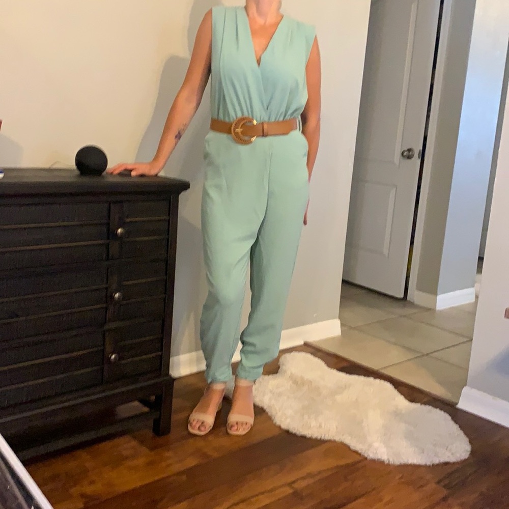 Sage green jumper with a brown moon shaped belt